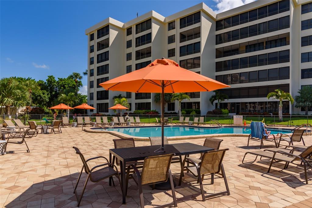 5780 Midnight Pass Road, Unit 210 Sarasota, FL 34242 - Photo 49 of 58 a view of pool with outdoor seating