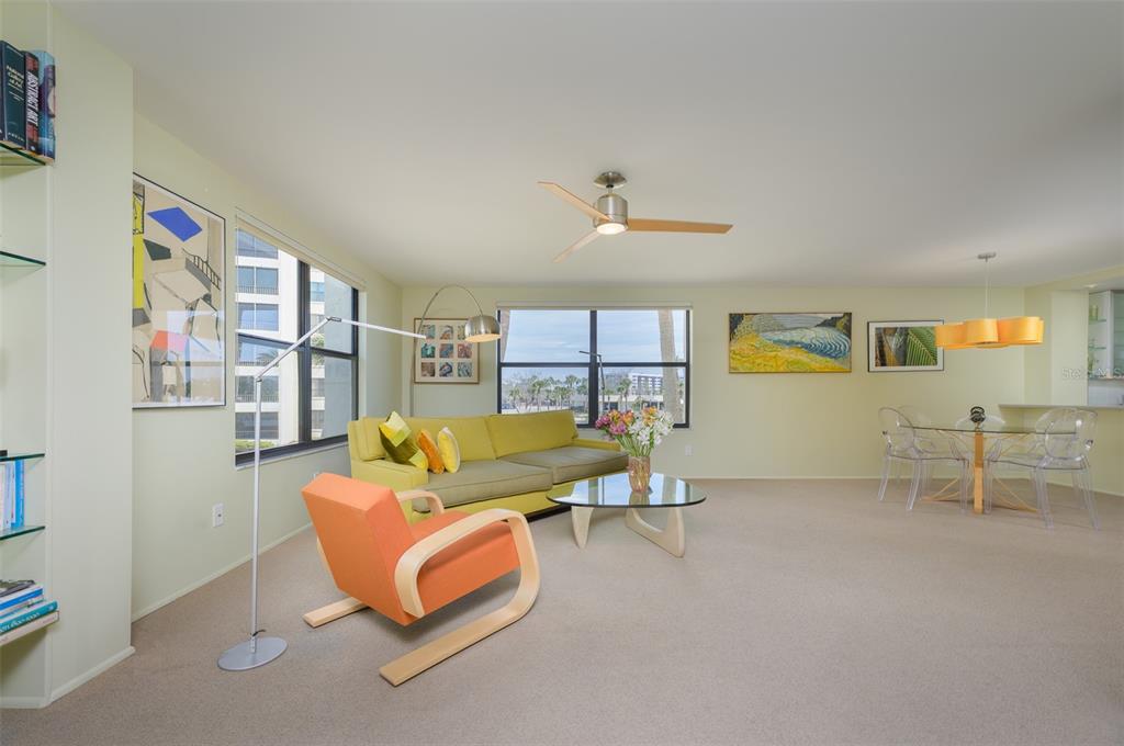 5780 Midnight Pass Road, Unit 210 Sarasota, FL 34242 - Photo 10 of 58 a living room with furniture and a table