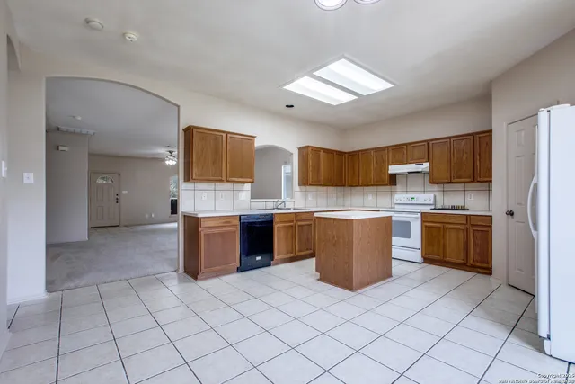a large kitchen with a cabinets and counter space
