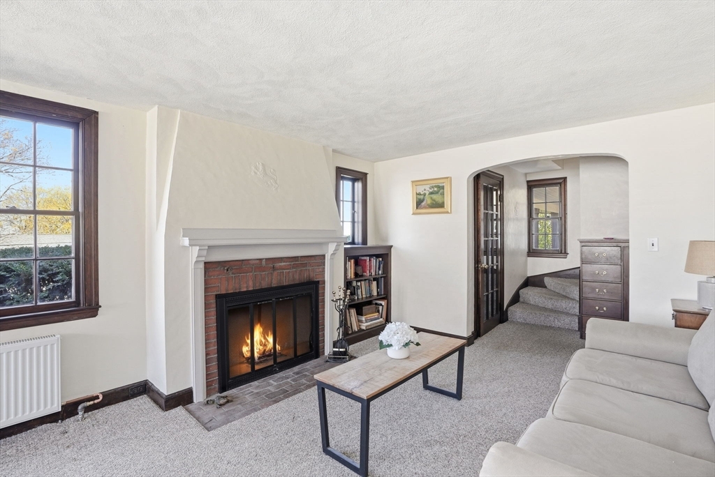 34 Governor Long Road Hingham, MA 02043 - Photo 21 of 37 a living room with furniture a window and a fireplace