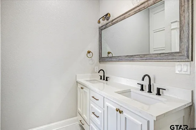 a white toilet sitting next to a bathtub