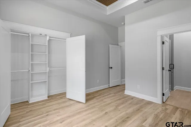 a bathroom with a granite countertop sink a toilet and a mirror