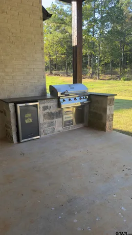a view of a kitchen with a sink and a fireplace