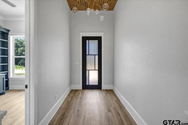 a view of living room with furniture and wooden floor