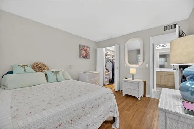 a view of staircase with lots of frames on wall and a window