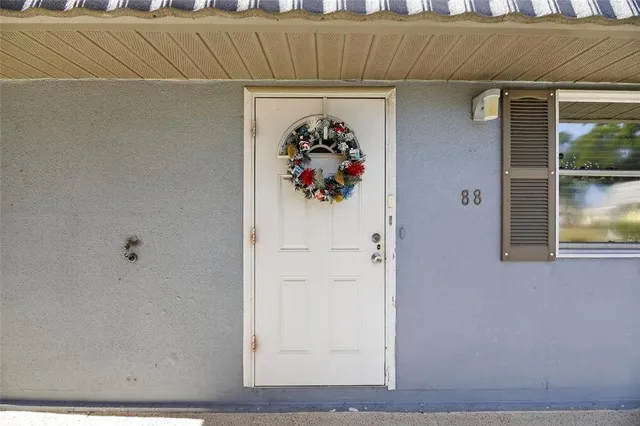 a bedroom with a bed and a table in it