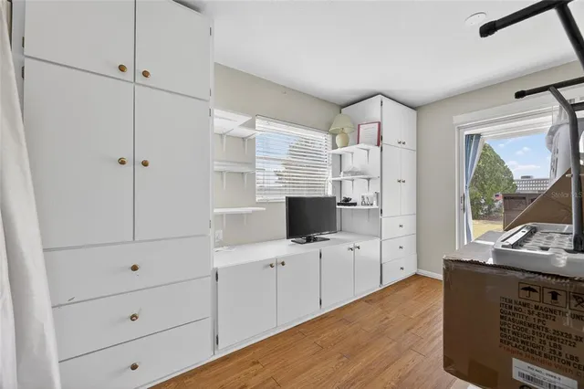 a bathroom with a shower curtain and a sink