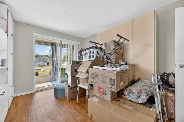a view of a house with a patio and a yard
