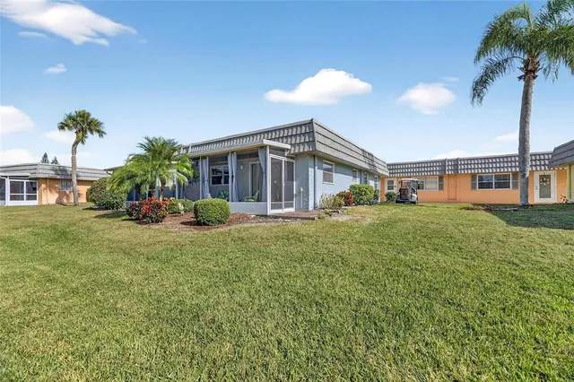 a view of an house with backyard porch and wooden floor