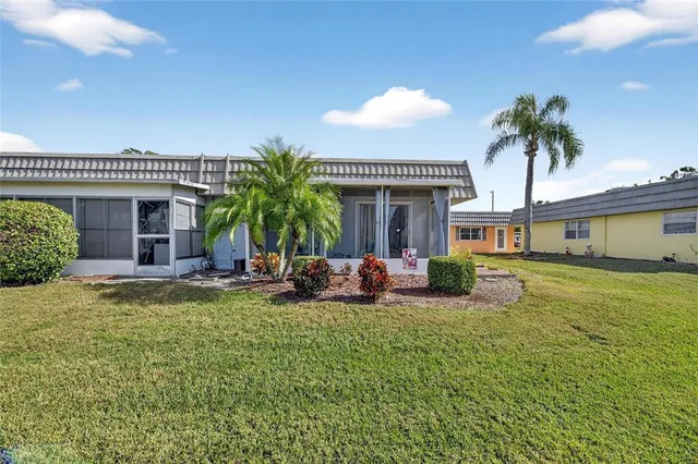 a view of a brick house with a large window
