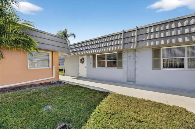 a group of people sitting at tables in a living room