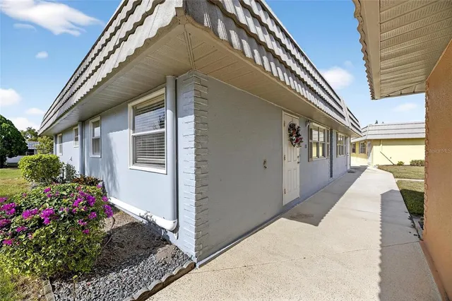a view of a swimming pool with outdoor seating