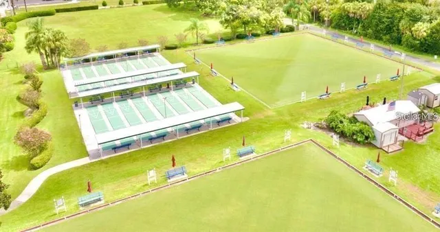 a view of a swimming pool with outdoor seating