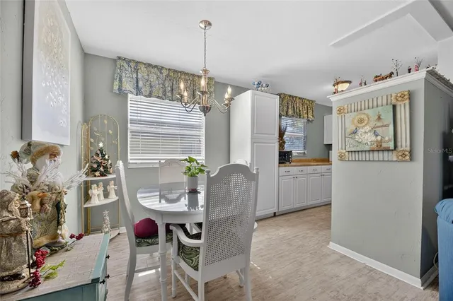 a kitchen with a refrigerator and a sink