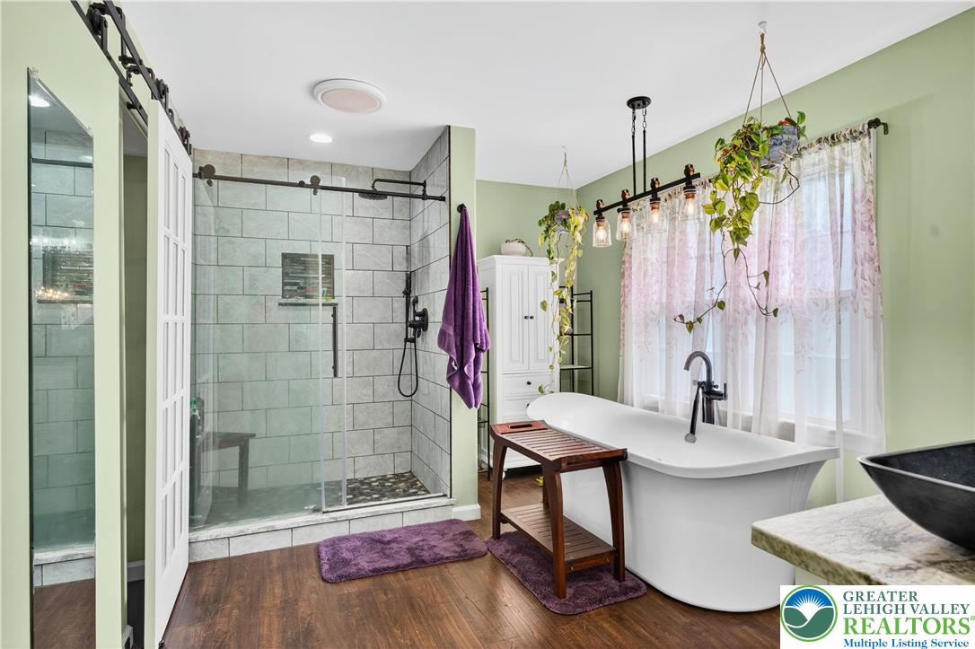 4164 Hecktown Road Bethlehem, PA 18020 - Photo 13 of 39 a bathroom with a sink and a mirror