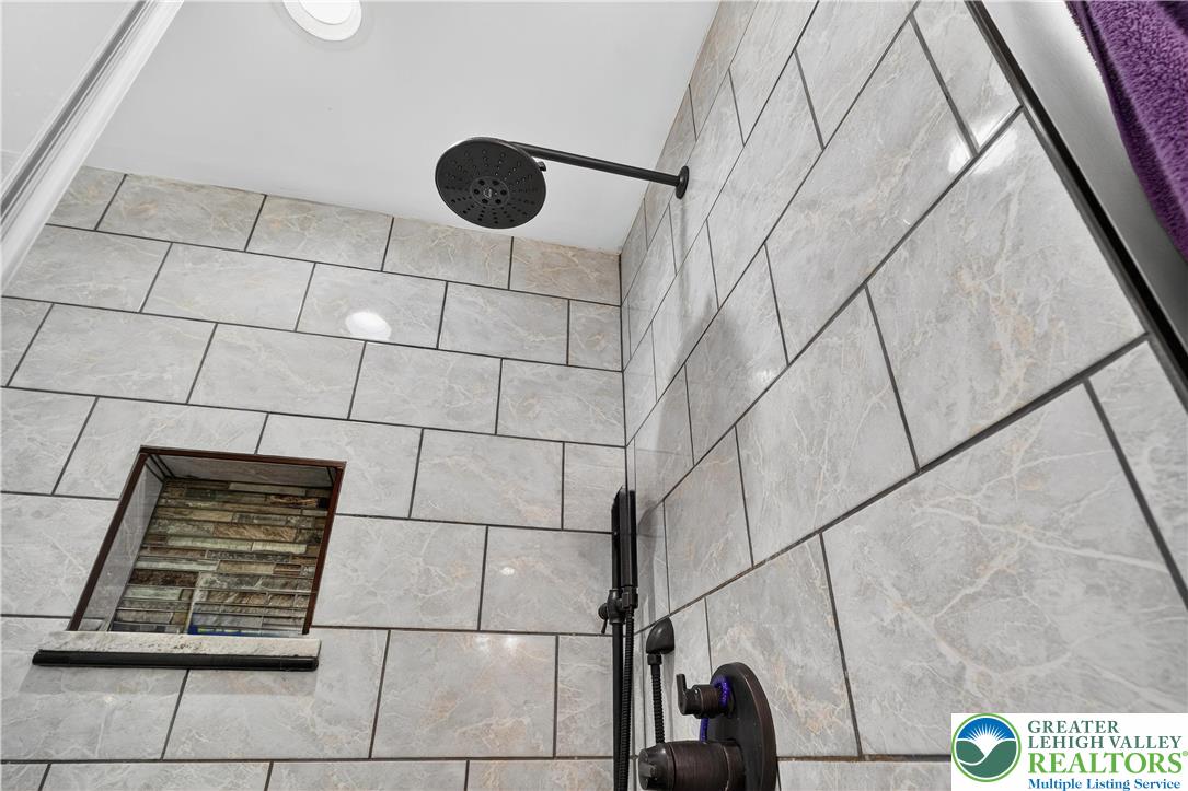 4164 Hecktown Road Bethlehem, PA 18020 - Photo 14 of 39 a bathroom with a sink and a shower