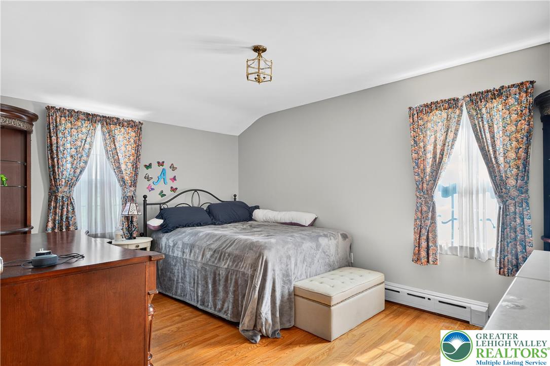 4164 Hecktown Road Bethlehem, PA 18020 - Photo 16 of 39 a bedroom with a bed and a window