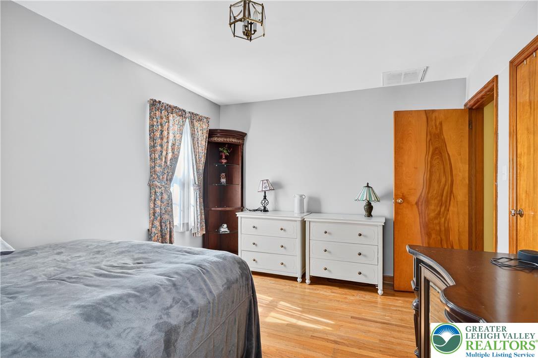 4164 Hecktown Road Bethlehem, PA 18020 - Photo 17 of 39 a bedroom with a bed and a dresser