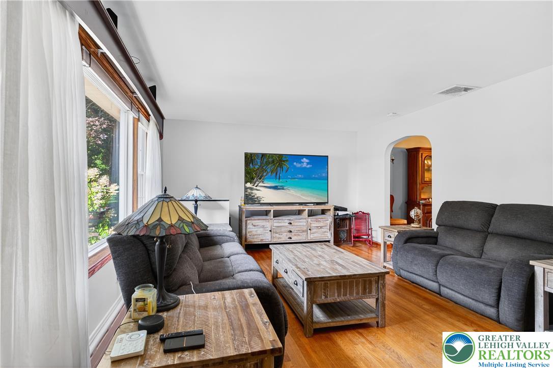 4164 Hecktown Road Bethlehem, PA 18020 - Photo 2 of 39 a living room with furniture and a flat screen tv