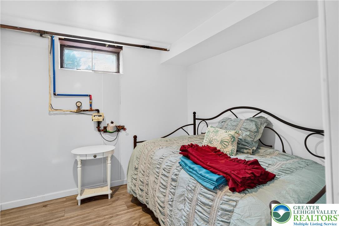 4164 Hecktown Road Bethlehem, PA 18020 - Photo 22 of 39 a bedroom with a bed and a lamp on dresser