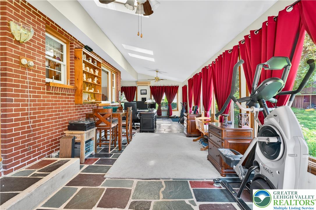 4164 Hecktown Road Bethlehem, PA 18020 - Photo 23 of 39 a room with lots of white furniture and a chandelier