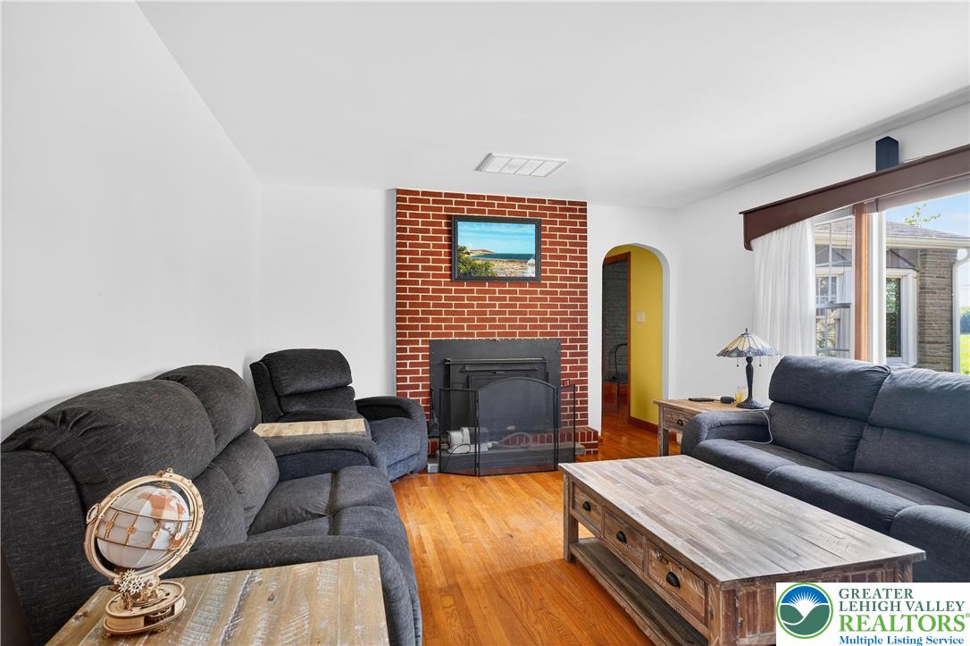 4164 Hecktown Road Bethlehem, PA 18020 - Photo 3 of 39 a living room with furniture and a fireplace