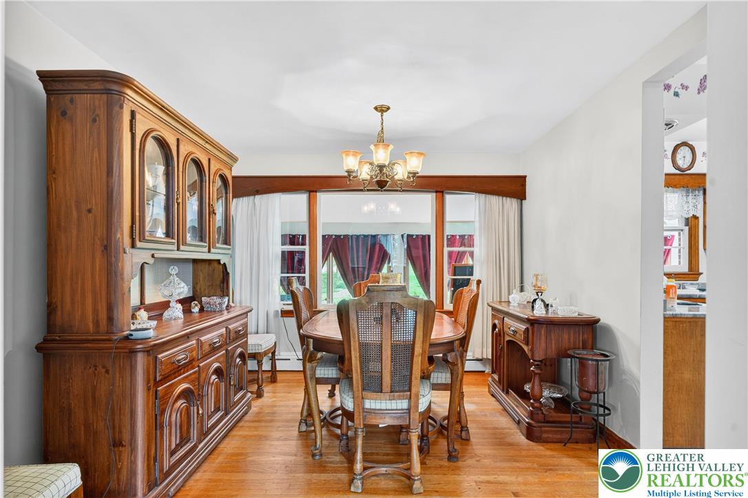 4164 Hecktown Road Bethlehem, PA 18020 - Photo 5 of 39 a view of a dining room with furniture window and wooden floor