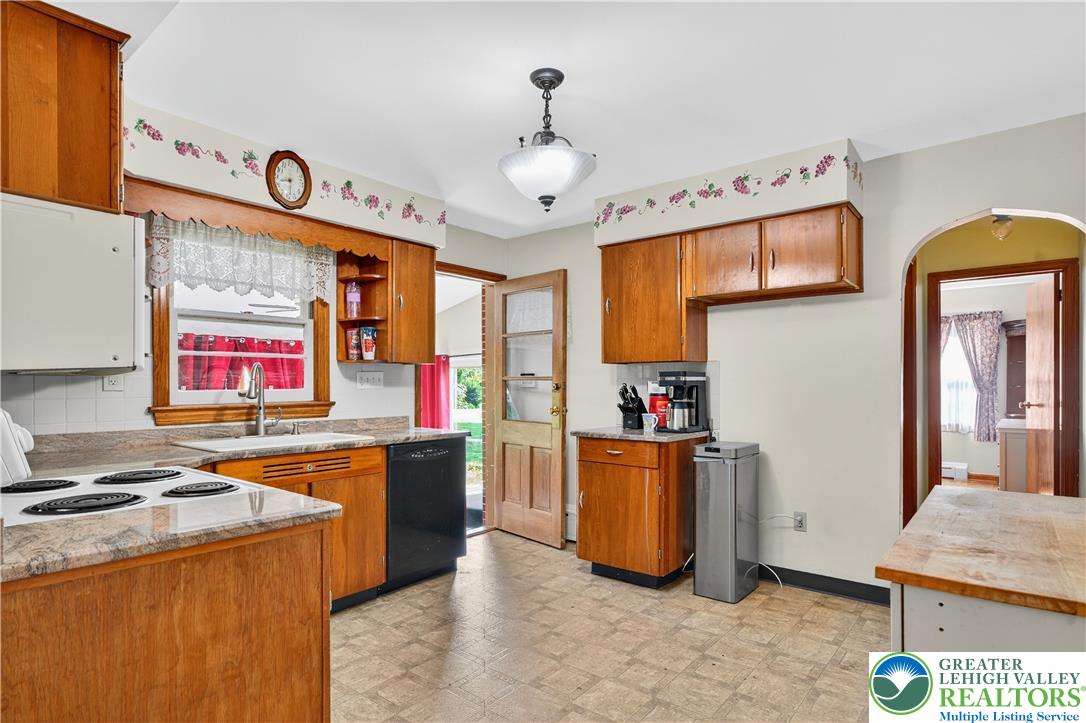 4164 Hecktown Road Bethlehem, PA 18020 - Photo 7 of 39 a open kitchen with stainless steel appliances granite countertop a stove and a refrigerator