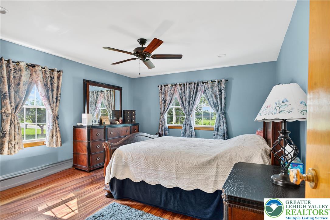 4164 Hecktown Road Bethlehem, PA 18020 - Photo 10 of 39 a bed sitting in a bedroom next to a window