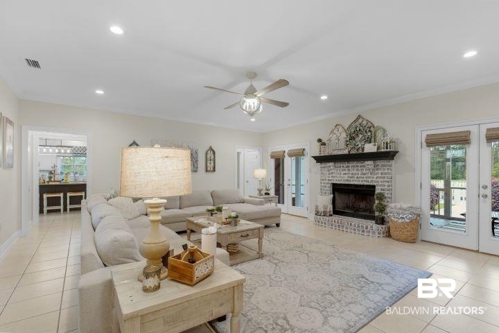24541 Baldwin Beach Expressway Robertsdale, AL 36567 - Photo 8 of 51 Living area featuring a ceiling fan, visible vents, french doors, and light tile patterned floors