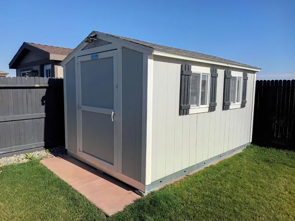 a view of backyard with cabin
