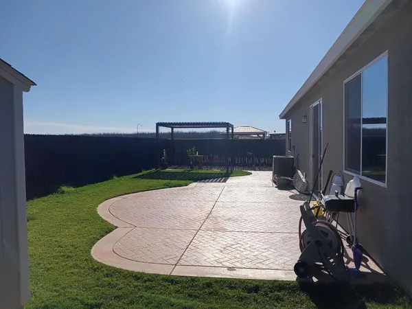 a view of backyard with entertaining space
