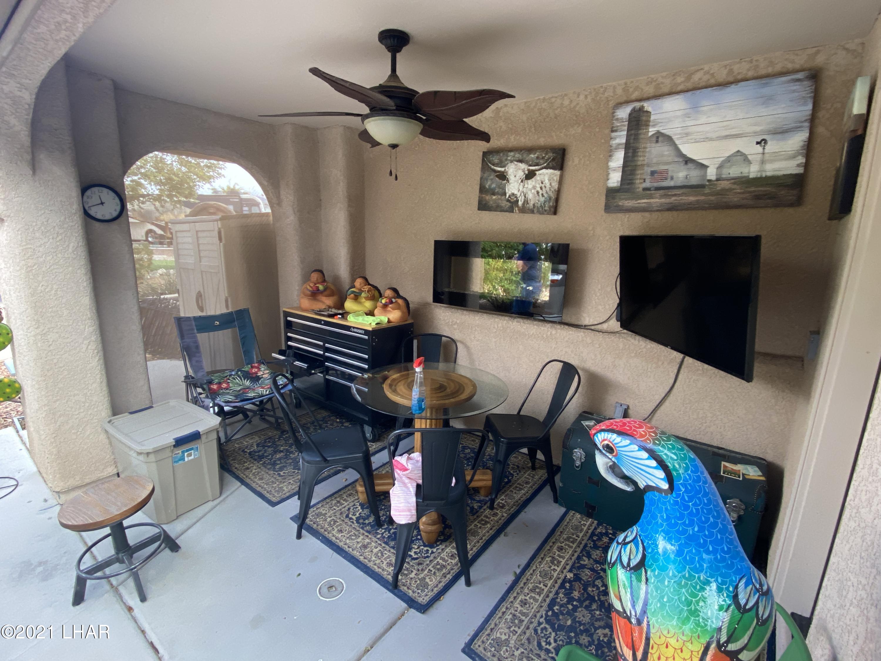 1905 Victoria Farms Road, Unit 54 Lake Havasu City, AZ 86404 - Photo 12 of 22 a living room with furniture and a fireplace