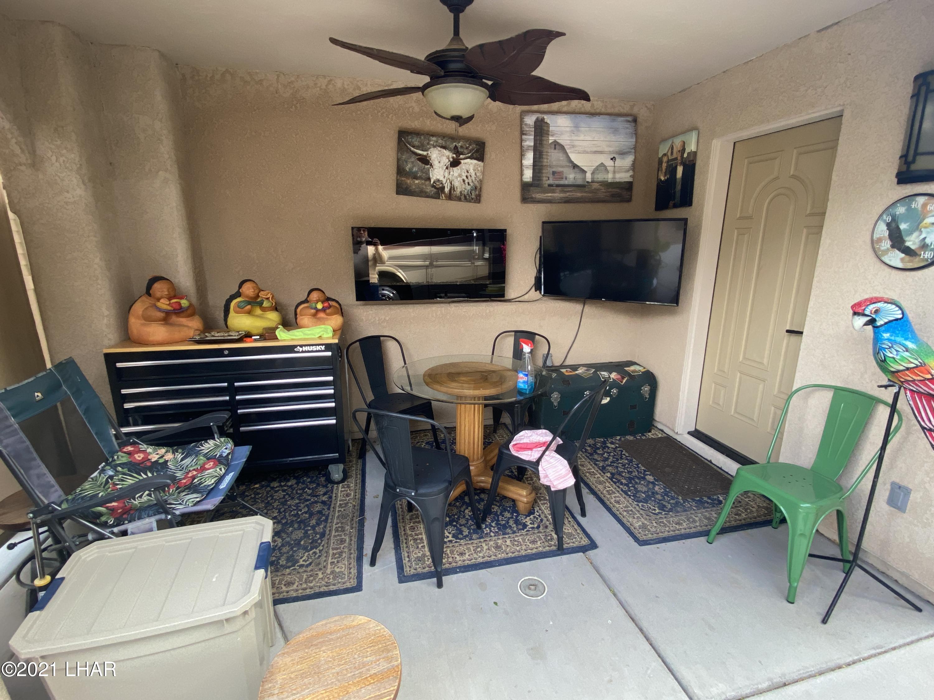 1905 Victoria Farms Road, Unit 54 Lake Havasu City, AZ 86404 - Photo 13 of 22 a living room with furniture a flat screen tv and a couch