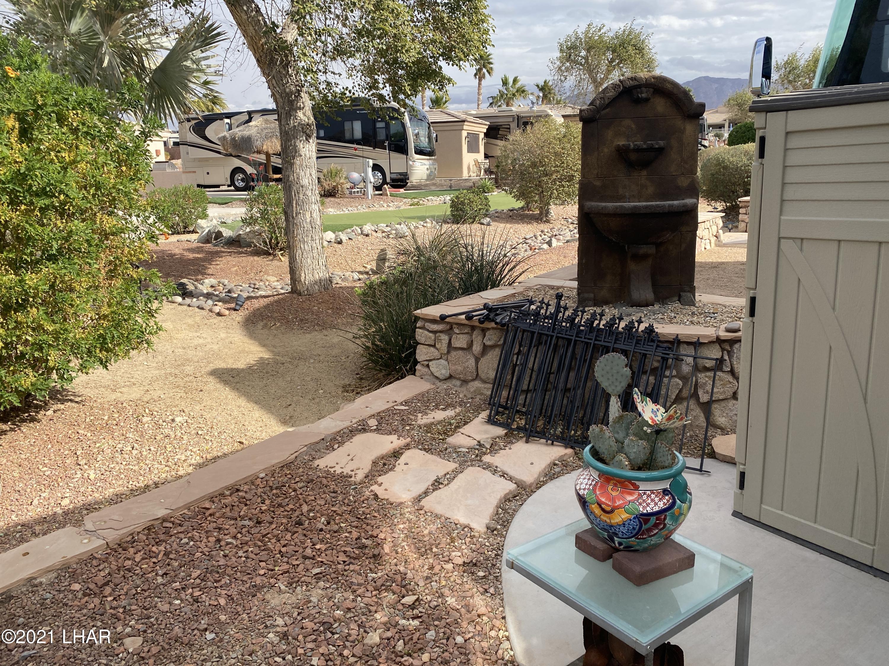 1905 Victoria Farms Road, Unit 54 Lake Havasu City, AZ 86404 - Photo 14 of 22 a backyard of a house with seating space