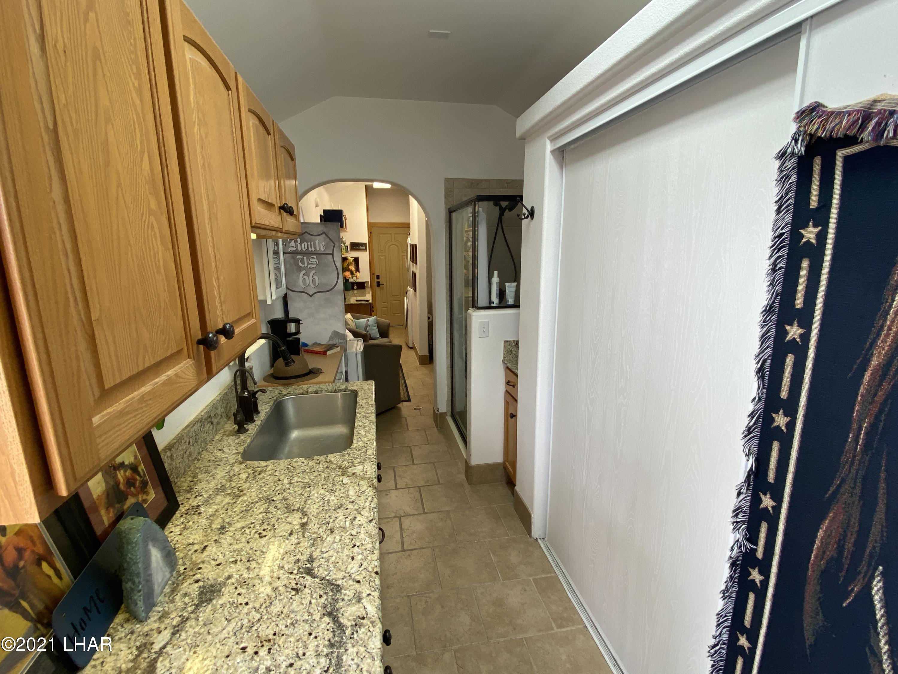 1905 Victoria Farms Road, Unit 54 Lake Havasu City, AZ 86404 - Photo 6 of 22 a hallway with a large window