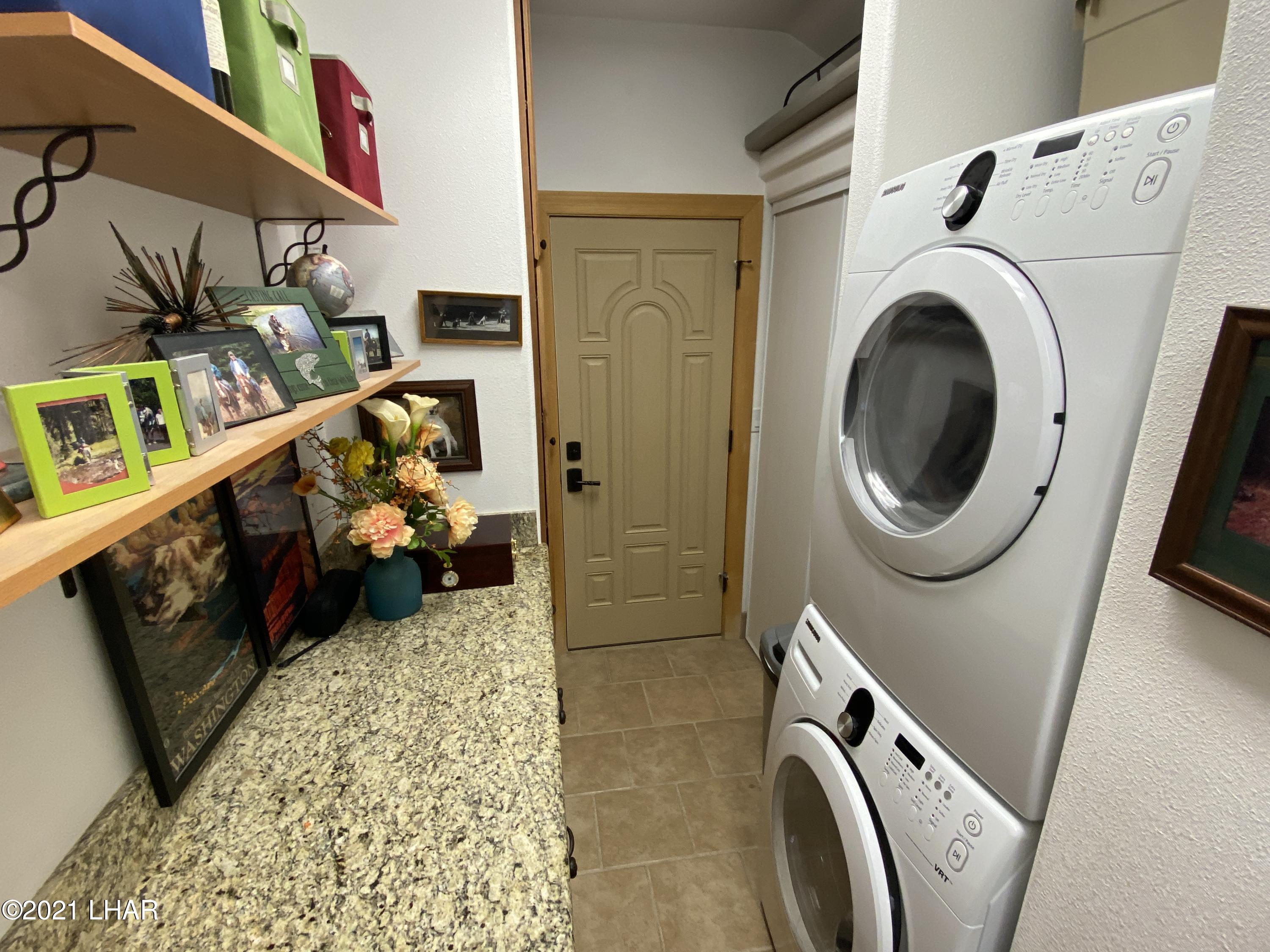 1905 Victoria Farms Road, Unit 54 Lake Havasu City, AZ 86404 - Photo 9 of 22 a utility room with dryer and washer