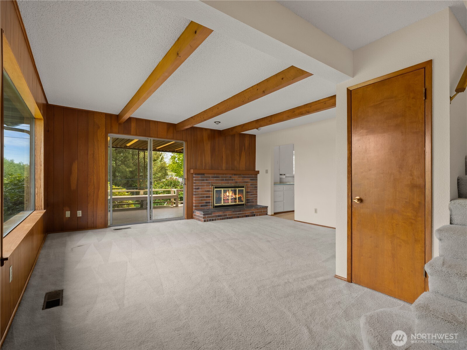 5704 North Ruby Street Tacoma, WA 98407 - Photo 6 of 38 a view of an empty room with a fireplace and a window