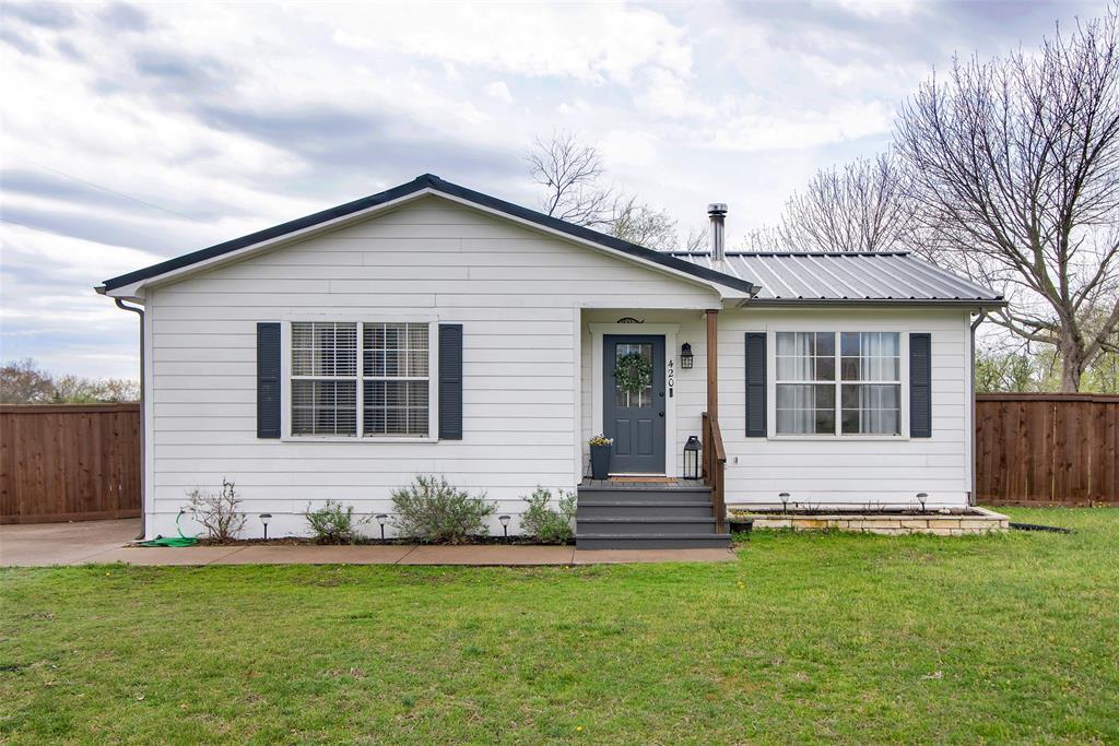 420 Rockcrest Road New Hope, TX 75071 - Photo 1 of 1 View of front of house with metal roof, fence, and a front yard