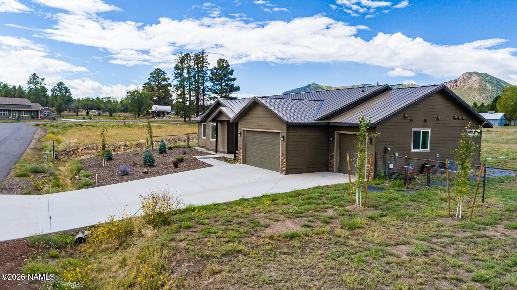 10272 Fw Mclure Road Flagstaff, AZ 86004 - Photo 19 of 38 a house with swimming pool in front of it