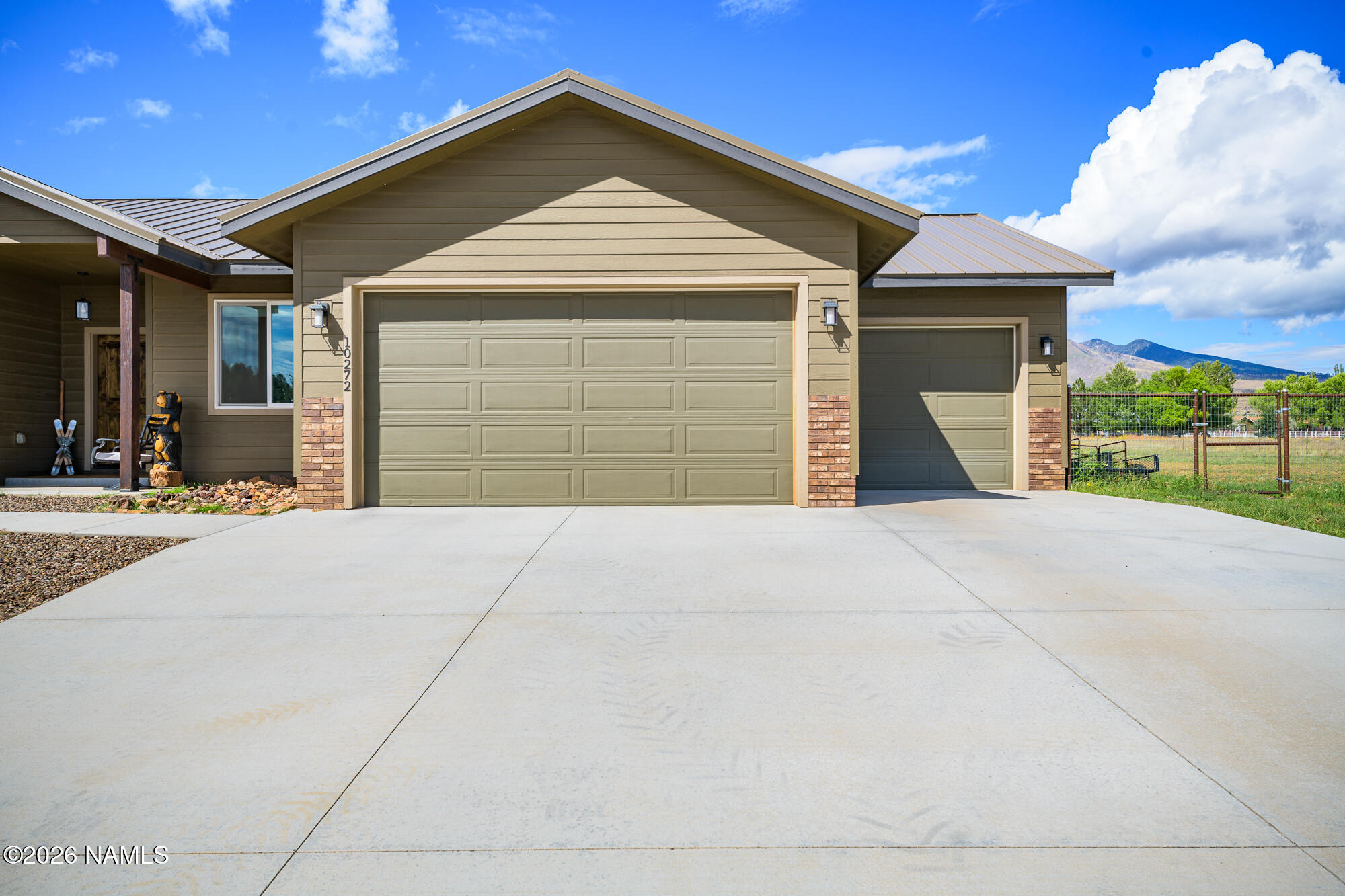 10272 Fw Mclure Road Flagstaff, AZ 86004 - Photo 23 of 38 a front view of a house with a garage