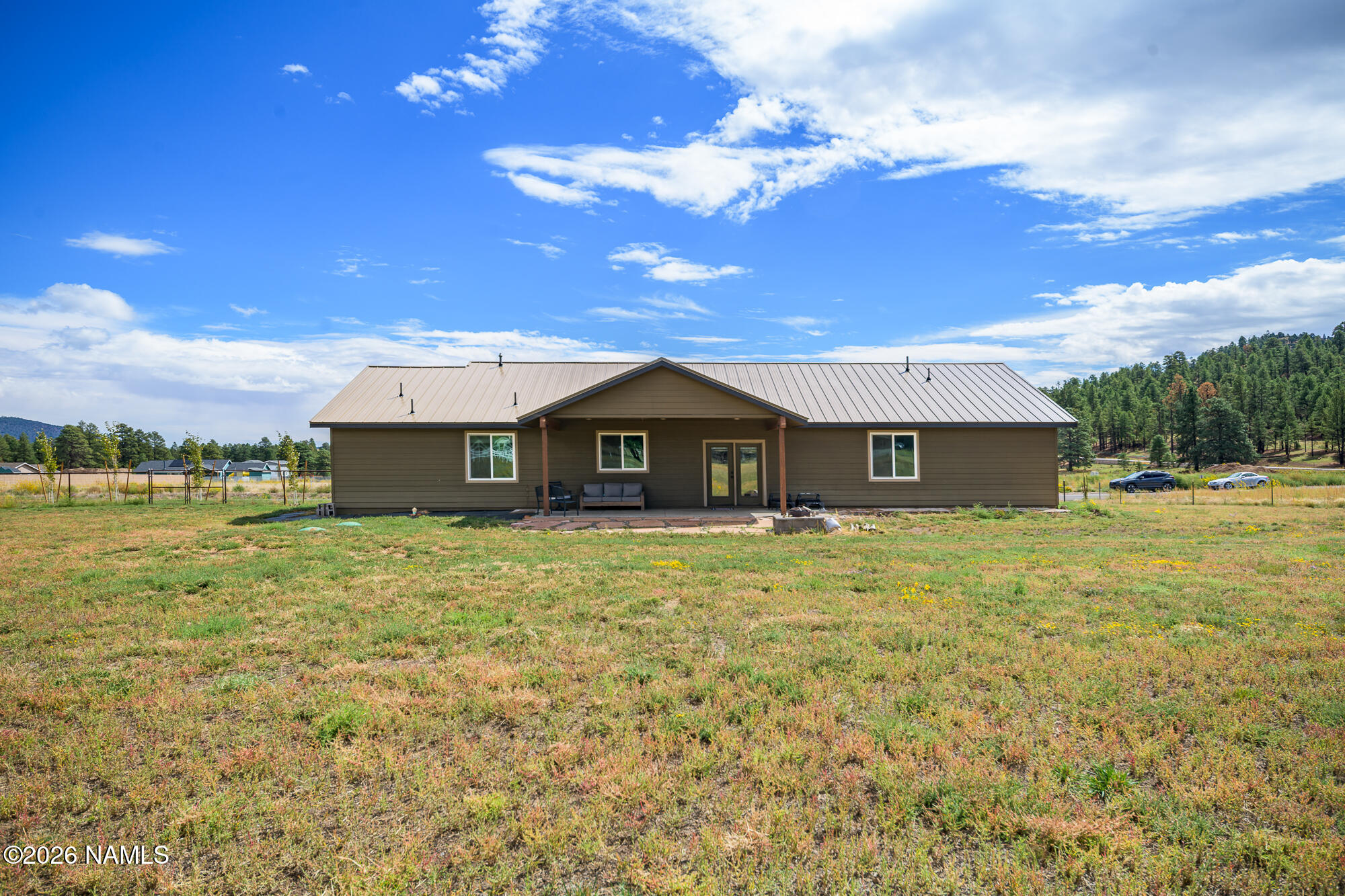 10272 Fw Mclure Road Flagstaff, AZ 86004 - Photo 24 of 38 a front view of a house with a yard