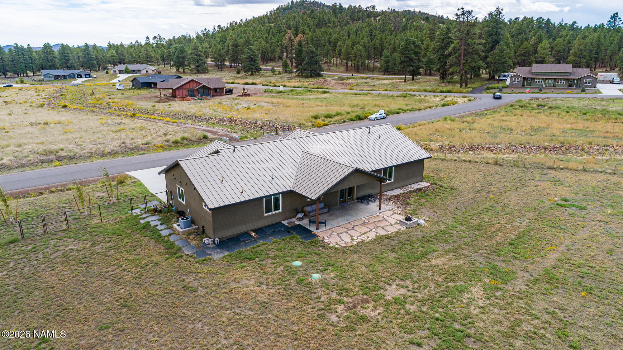 10272 Fw Mclure Road Flagstaff, AZ 86004 - Photo 25 of 38 a view of a swimming pool with a yard