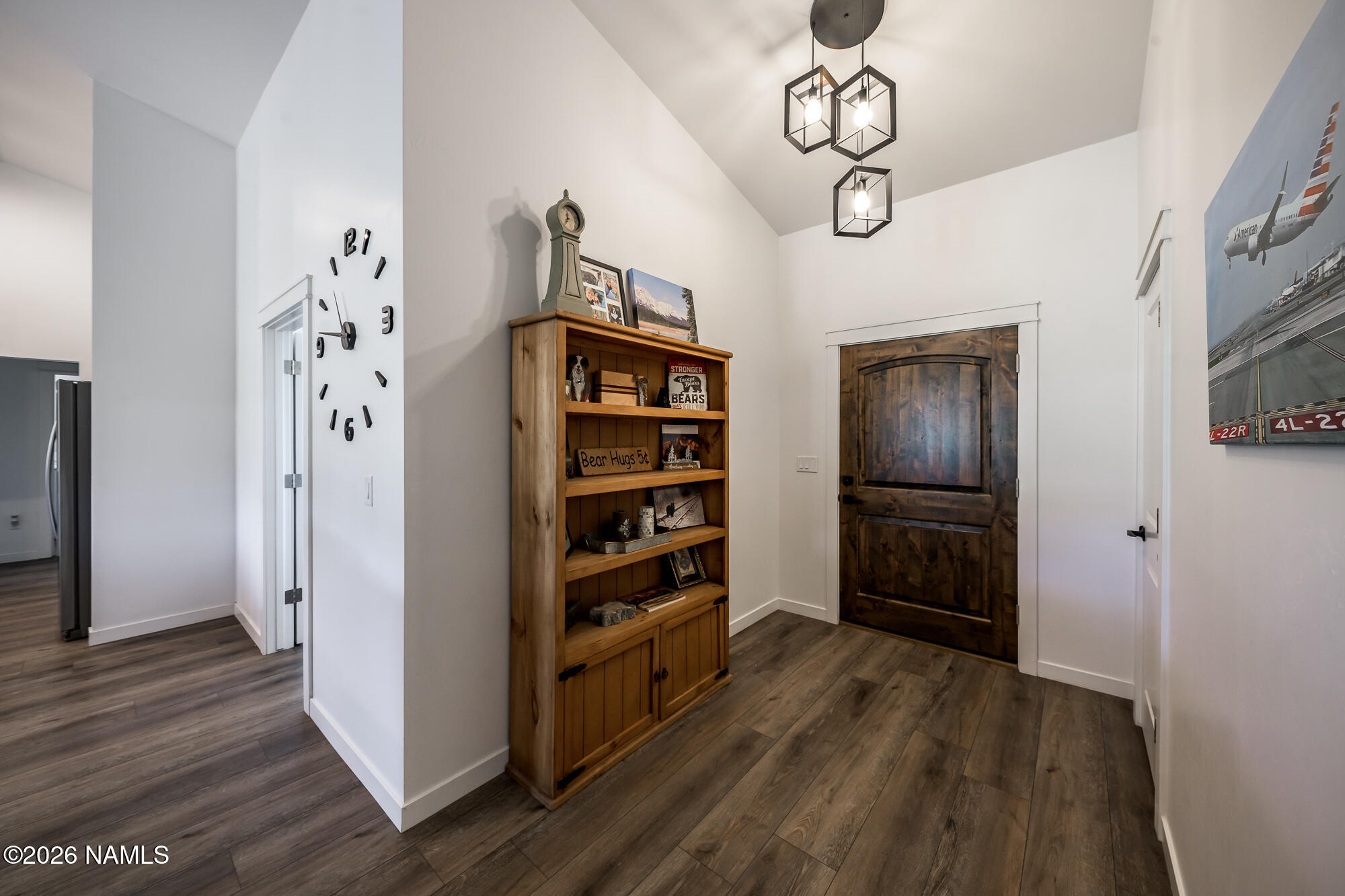 10272 Fw Mclure Road Flagstaff, AZ 86004 - Photo 30 of 38 a view of a kitchen with refrigerator and wooden floor