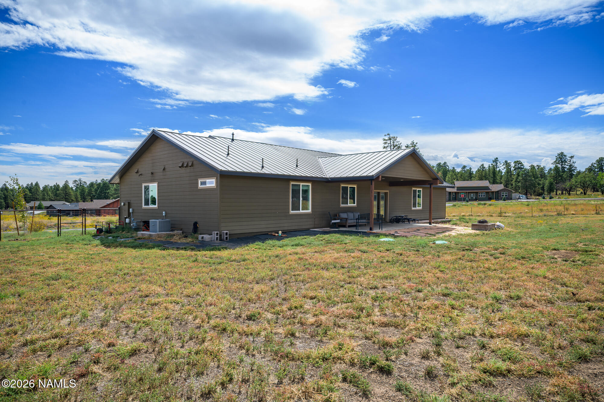 10272 Fw Mclure Road Flagstaff, AZ 86004 - Photo 33 of 38 a front view of a house with garden