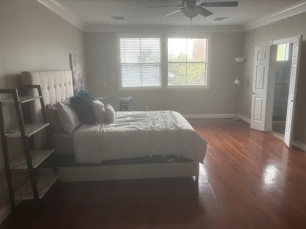 a bedroom with a bed and window