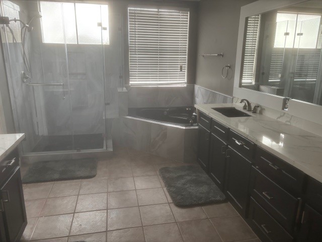 1333 Fairview Street Houston, TX 77006 - Photo 23 of 27 a bathroom with a granite countertop sink a toilet a bathtub and shower