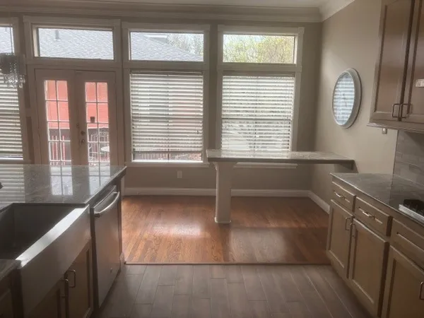 a view of a kitchen with a large window