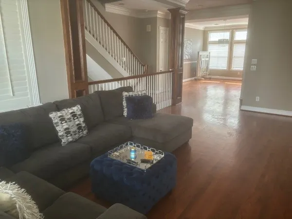 a living room with furniture and a large window