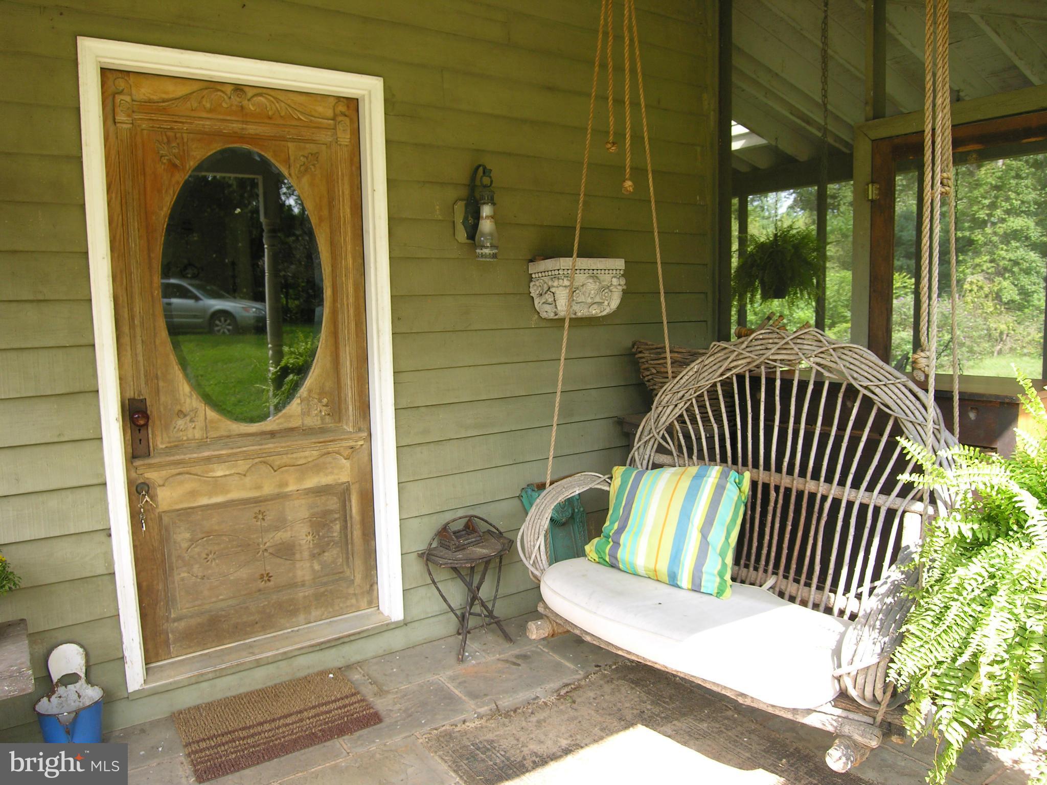 488 Quaintance Road Woodville, VA 22749 - Photo 2 of 20 Enjoy the evening breeze on your porch swing